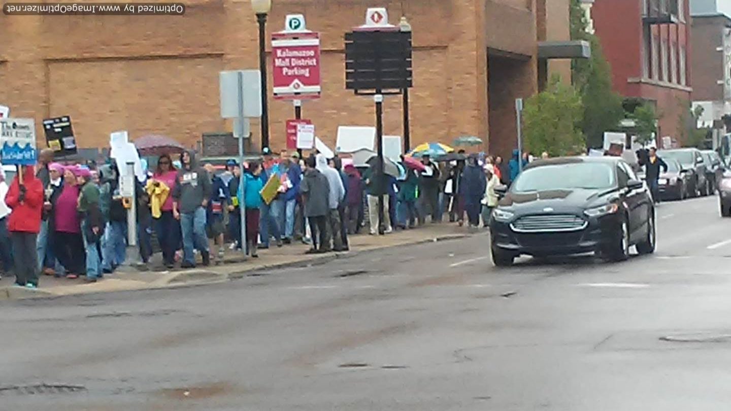 Activists waiting to cross the street in 2017 People's Climate March, Kalamazoo, MI